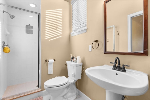 bathroom with tile patterned floors, sink, toilet, and an enclosed shower