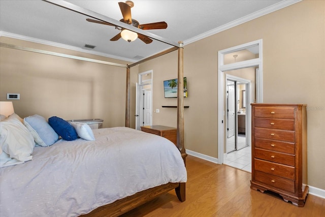 bedroom with ceiling fan, crown molding, and light wood-type flooring