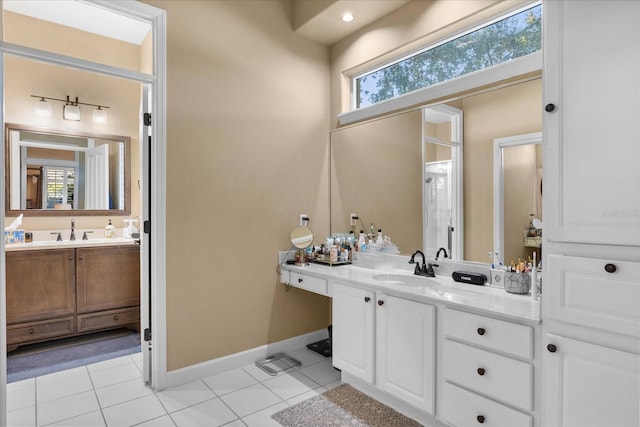 bathroom featuring vanity, tile patterned floors, and a wealth of natural light