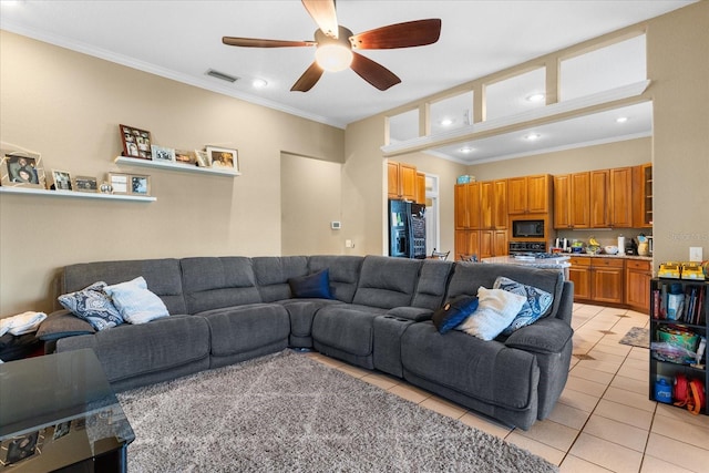 living room featuring crown molding, ceiling fan, and light tile patterned floors