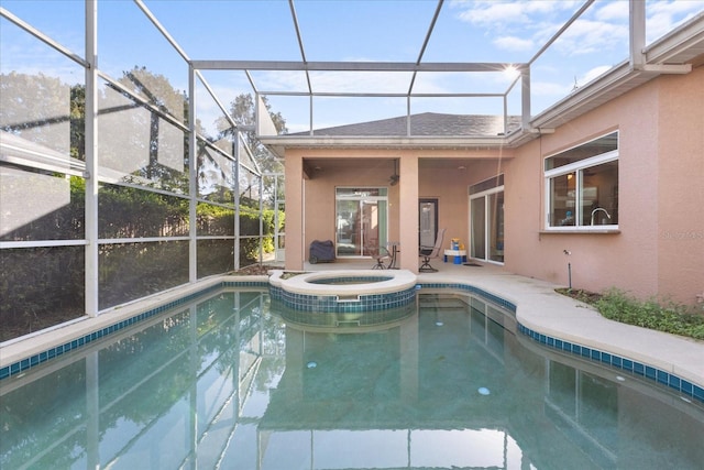 view of swimming pool featuring a patio area, ceiling fan, an in ground hot tub, and glass enclosure