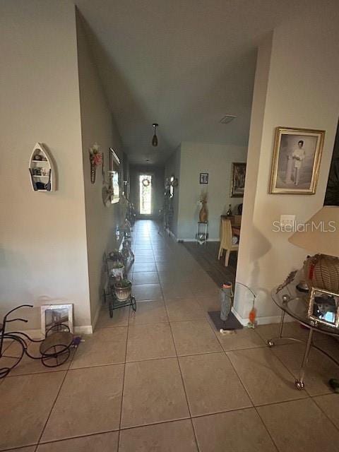 hall with light tile patterned flooring