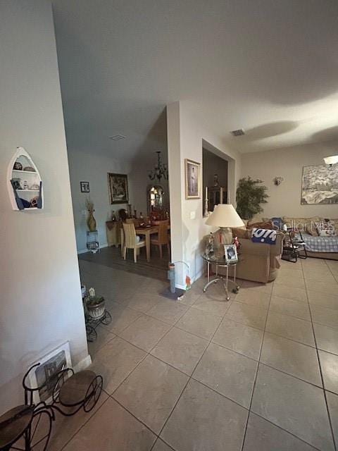 living room with tile patterned flooring