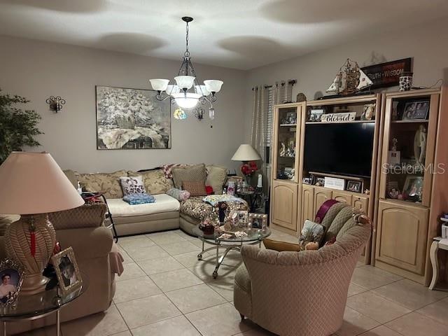 living room with light tile patterned flooring and a chandelier