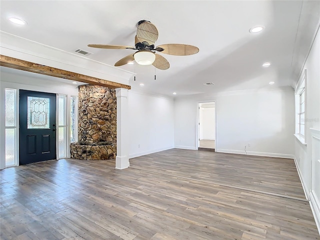 unfurnished living room featuring hardwood / wood-style floors and ceiling fan