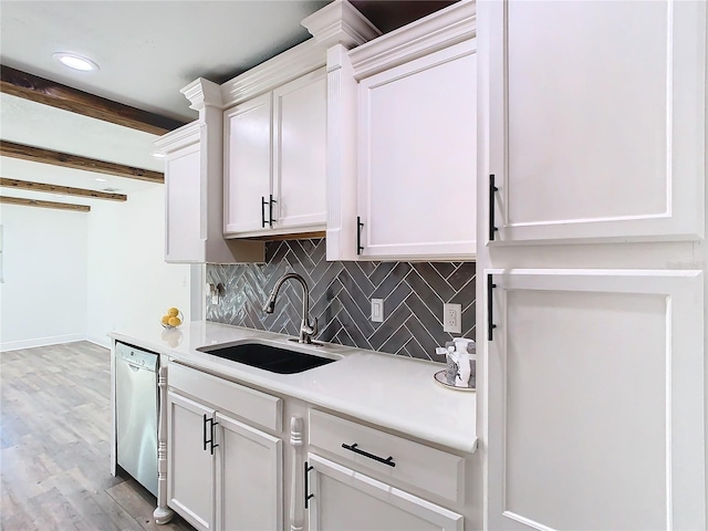 kitchen featuring sink, white cabinetry, dishwasher, and light hardwood / wood-style floors