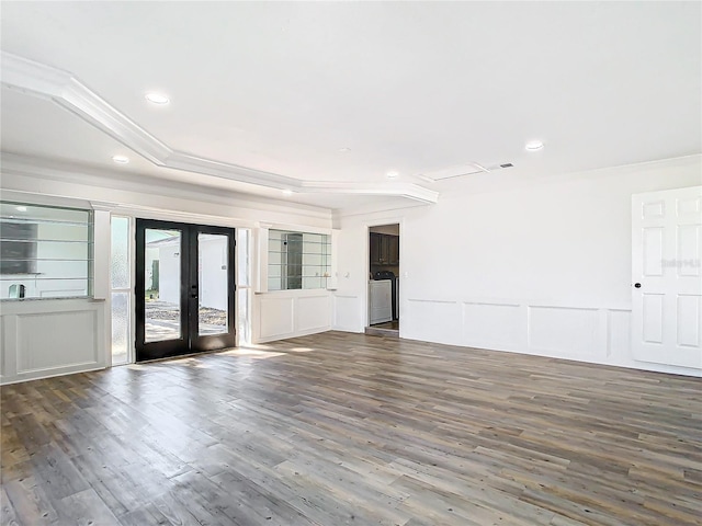 unfurnished room with washer / dryer, french doors, ornamental molding, and dark hardwood / wood-style flooring