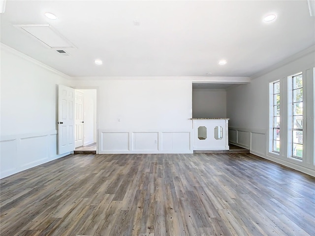 spare room with crown molding and hardwood / wood-style floors