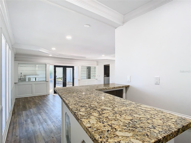 kitchen with crown molding, kitchen peninsula, french doors, and dark hardwood / wood-style flooring