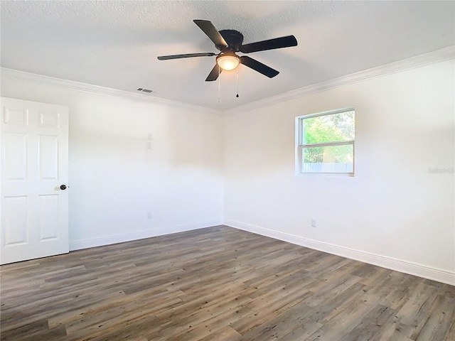 empty room with ornamental molding, dark hardwood / wood-style floors, a textured ceiling, and ceiling fan