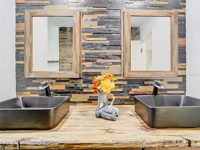 interior space with decorative backsplash and sink