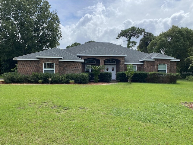 ranch-style house featuring a front yard