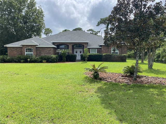 ranch-style home with a front yard