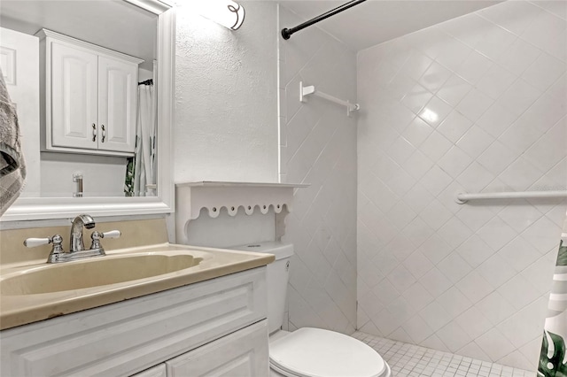 bathroom with vanity, toilet, and curtained shower