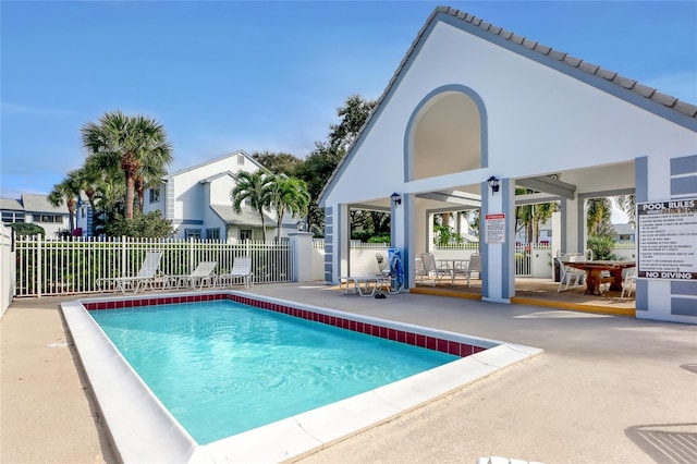 view of swimming pool with a patio area