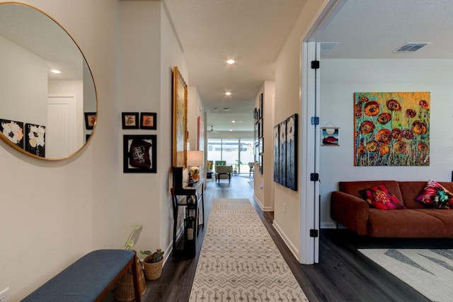 hall with dark wood-type flooring