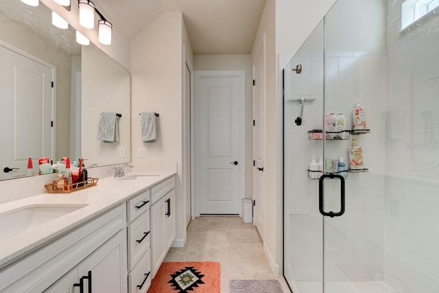 bathroom with vanity, tile patterned floors, and walk in shower