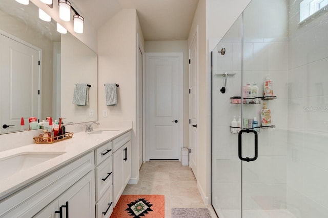 4009 Winding Meadows St, Apopka, FL 32712 - full bathroom featuring a stall shower, double vanity, a sink, and tile patterned floors