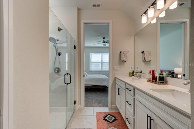 bathroom with vanity, an enclosed shower, ceiling fan, and tile patterned flooring