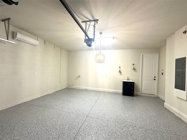 garage featuring a garage door opener, electric panel, a wall unit AC, and baseboards