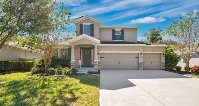 view of front of house featuring a front lawn and a garage