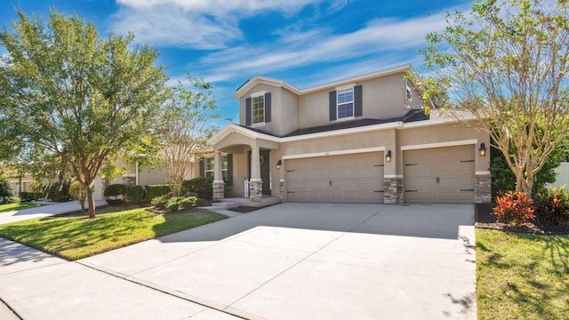 521 Morgan Wood Dr, Deland, FL 32724 - traditional-style house featuring stucco siding, a garage, driveway, stone siding, and a front lawn