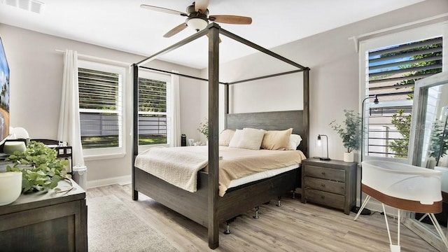 bedroom with light hardwood / wood-style flooring and ceiling fan