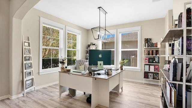 office featuring a notable chandelier and light wood-type flooring