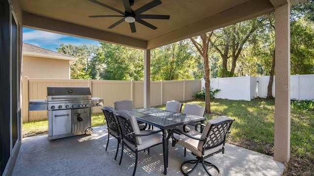 view of patio / terrace with grilling area and ceiling fan