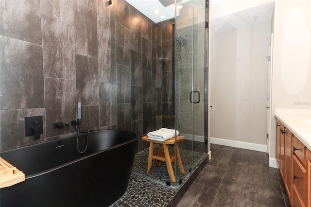 bathroom featuring vanity, tile patterned floors, and plus walk in shower