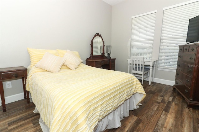 bedroom featuring dark hardwood / wood-style flooring