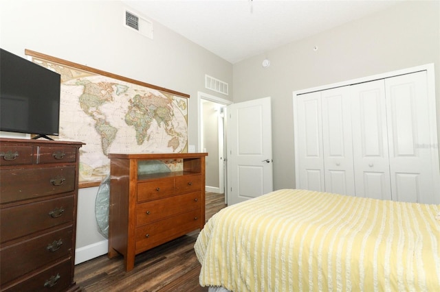 bedroom with a closet and dark wood-type flooring