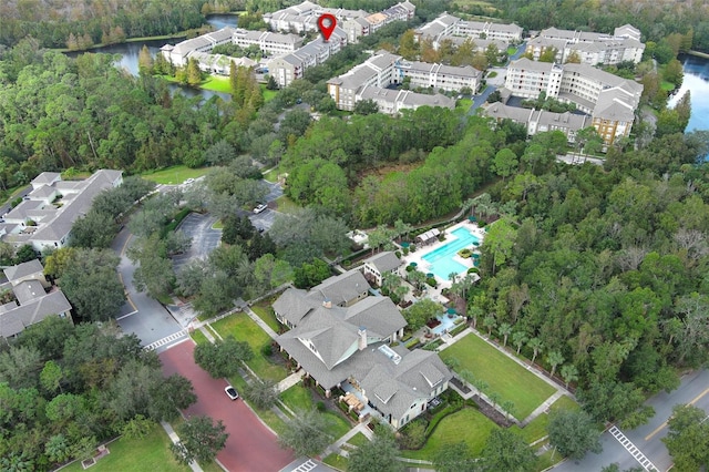 birds eye view of property with a water view