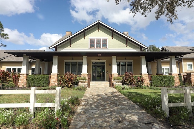 view of front facade with covered porch and a front lawn