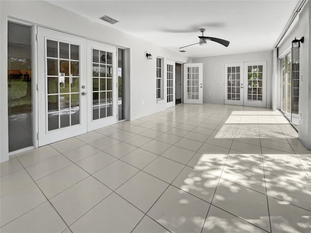 tiled spare room with french doors and ceiling fan