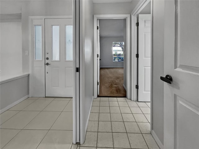 entrance foyer with light tile patterned floors