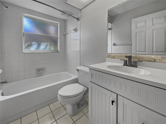 full bathroom with vanity, toilet, tile patterned floors, and tiled shower / bath