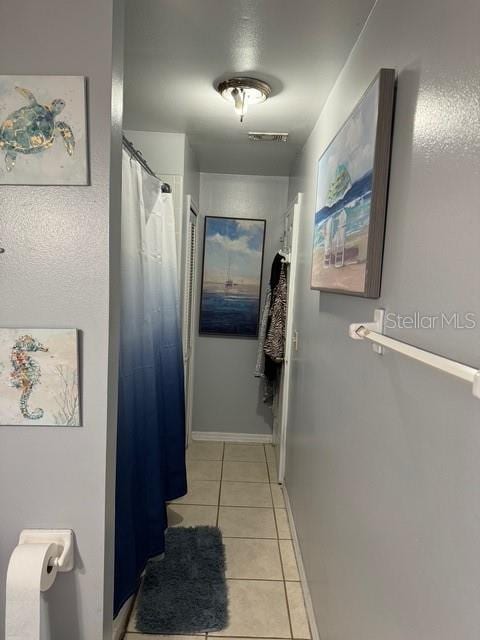 bathroom featuring tile patterned flooring