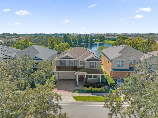 bird's eye view featuring a water view and a residential view