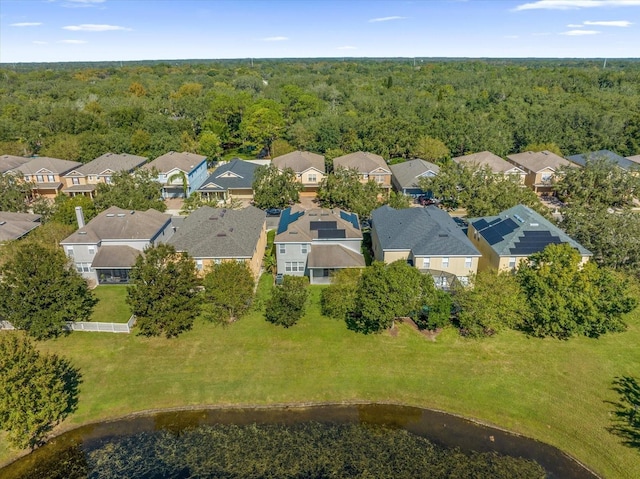 aerial view featuring a water view, a forest view, and a residential view