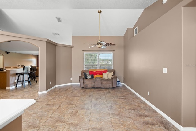 sitting room with high vaulted ceiling and ceiling fan