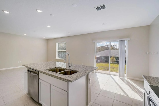 kitchen with white cabinets, an island with sink, light stone countertops, dishwasher, and sink