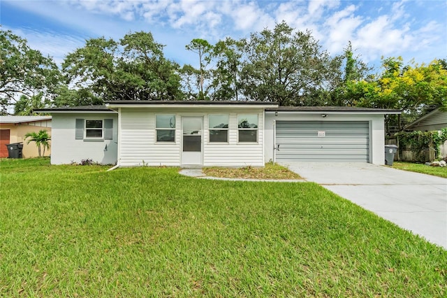 ranch-style house featuring a garage and a front lawn