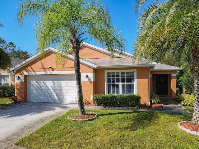 ranch-style home with a front yard and a garage