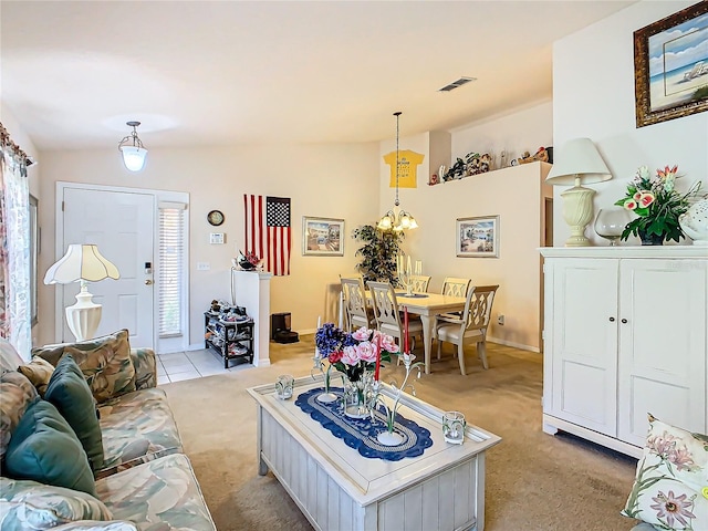 carpeted living room featuring vaulted ceiling