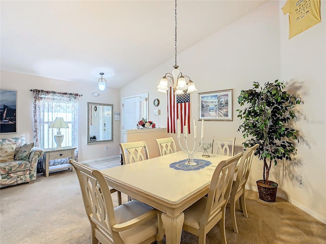 dining space featuring carpet flooring, vaulted ceiling, and an inviting chandelier