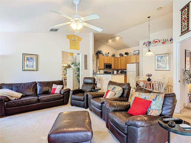 living room featuring lofted ceiling, light carpet, and ceiling fan