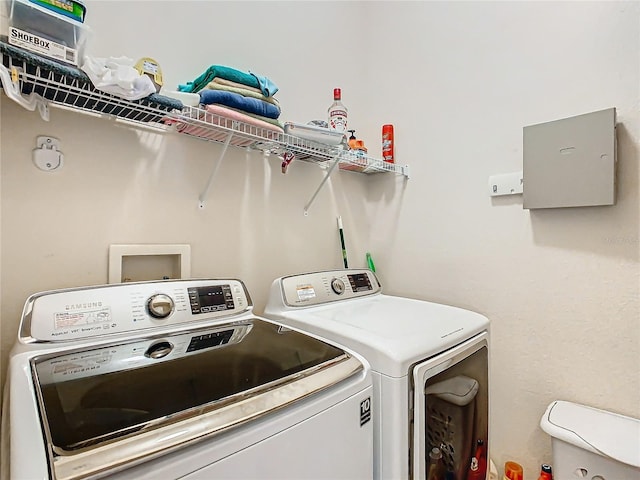 laundry area with washing machine and dryer