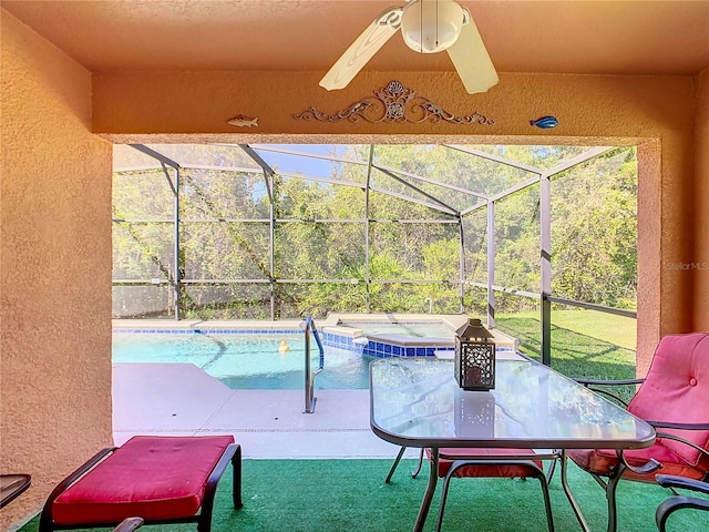 view of pool featuring a patio, ceiling fan, a lanai, and a jacuzzi