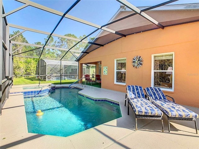 view of swimming pool with a patio area and glass enclosure